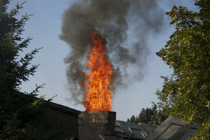 Chimney fire displaying the danger of neglecting Forked River chimney service